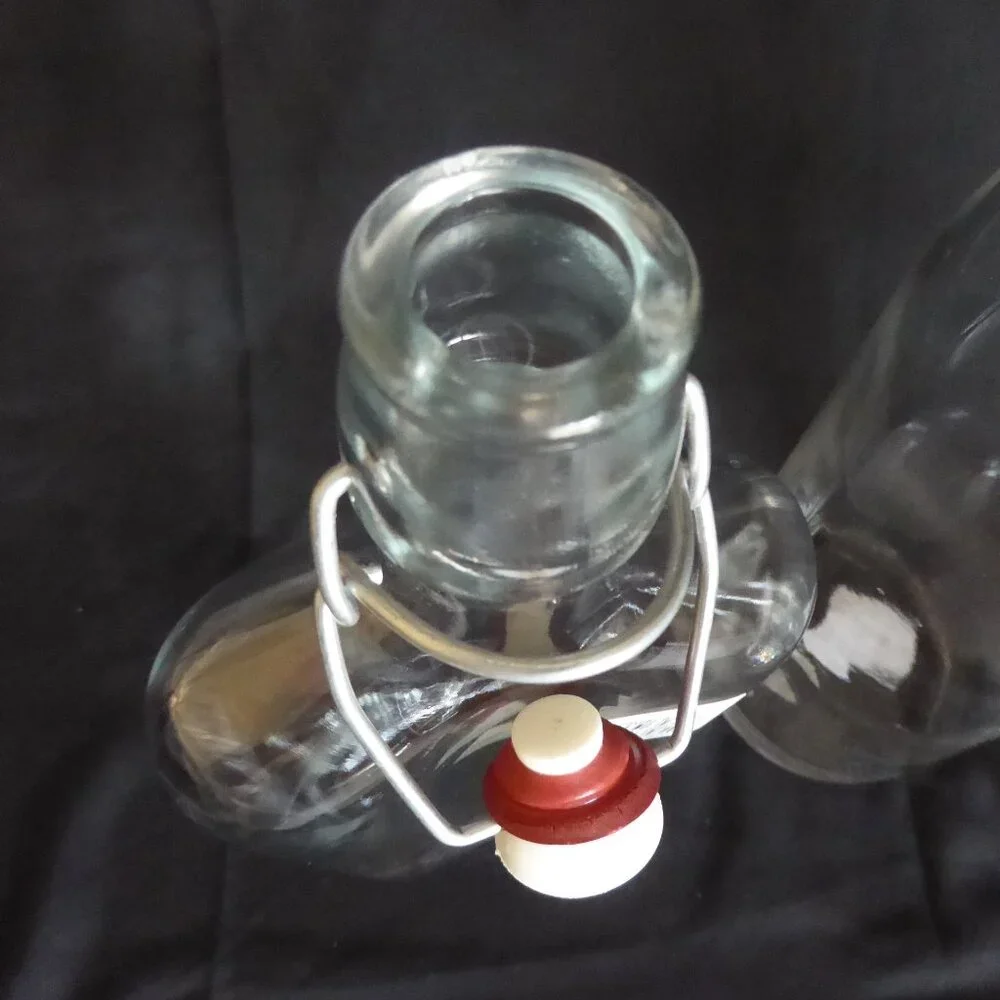 NEW 12.5” - 9.5” CRATE BARREL ITALY CLEAR GLASS AIR TIGHT LOCKING TOP 3 BOTTLES